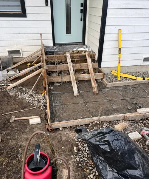 Broom Finish Driveway Replacement With Decorative Borders in Newcastle 